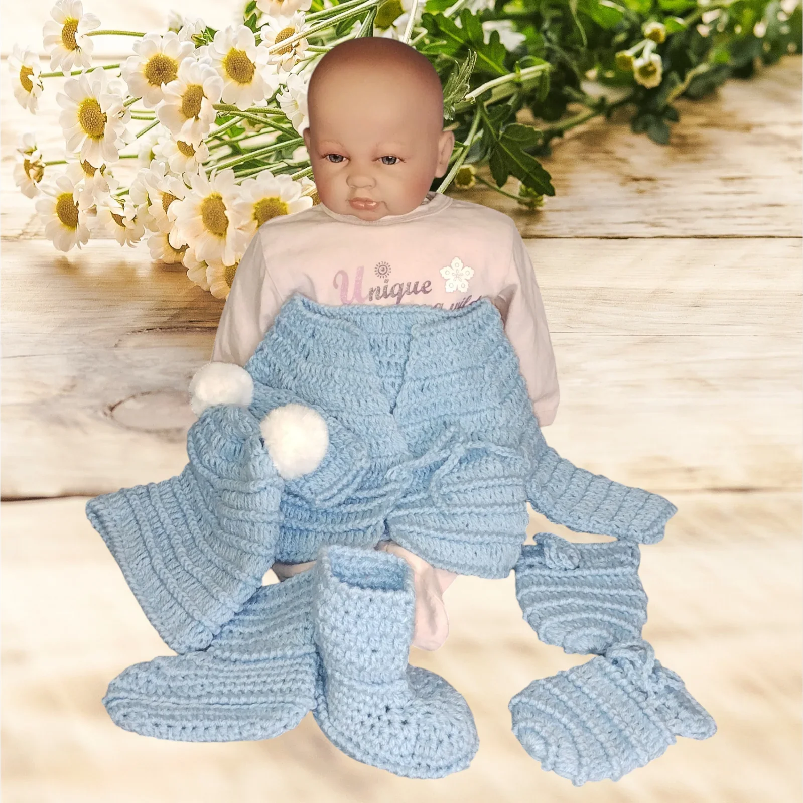 Handmade blue crochet baby clothes set with hat, booties, and mittens by Croch'pelotes
