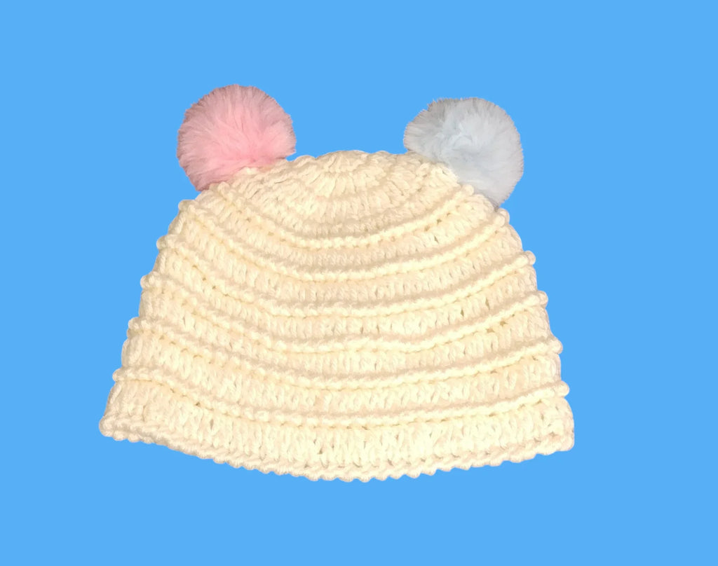 Handmade cream crochet baby hat with pink and blue pom poms, Croch'pelotes by Sophie