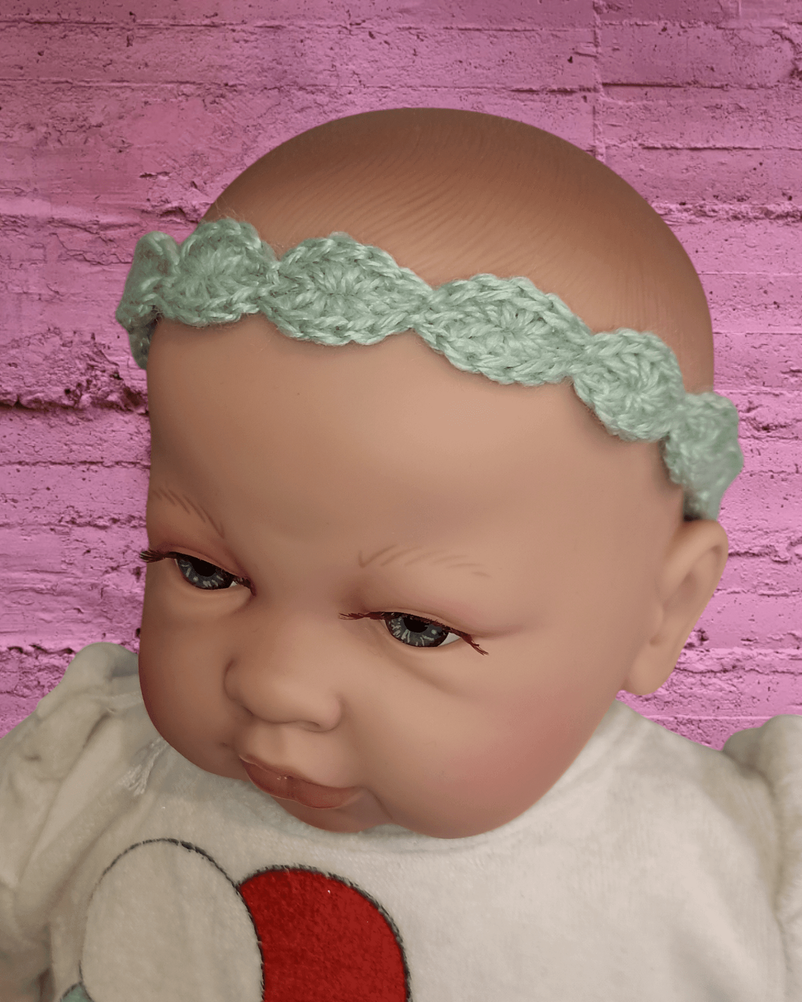 Hand-crocheted lemonade yellow baby headband on doll, Croch'pelotes by Sophie accessory